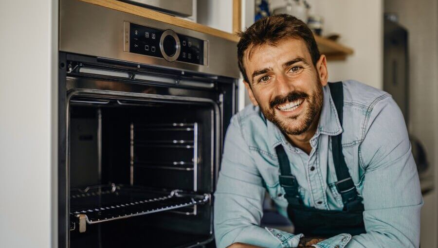 Two women chat about KnowS over a cup of coffee and look at the app on their smartphones.
